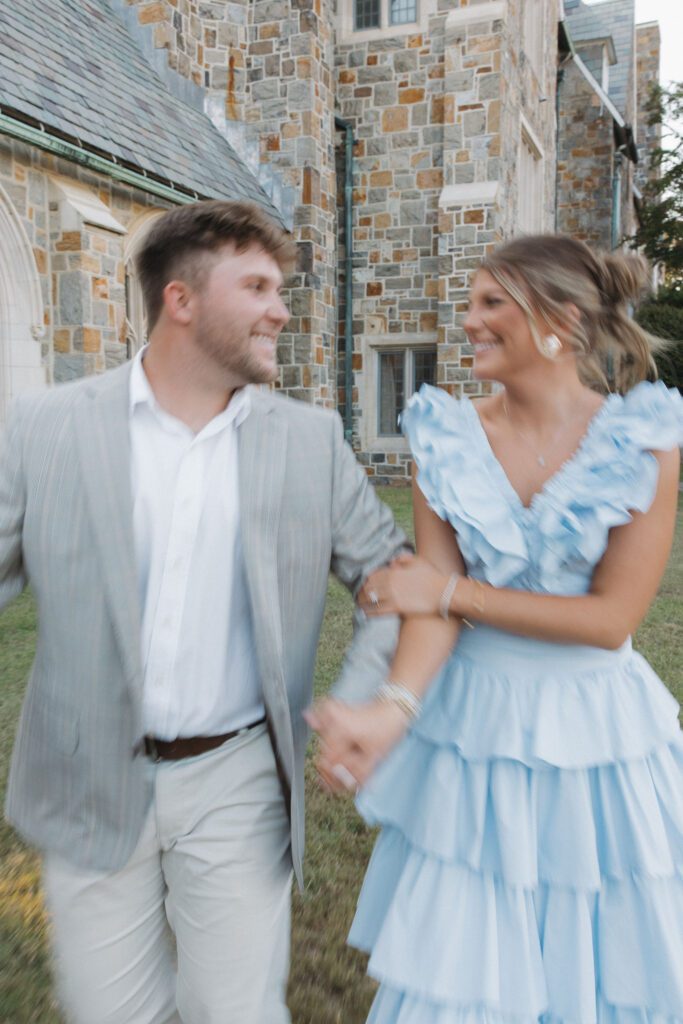 blurry photo of couple walking on the greens of berry college