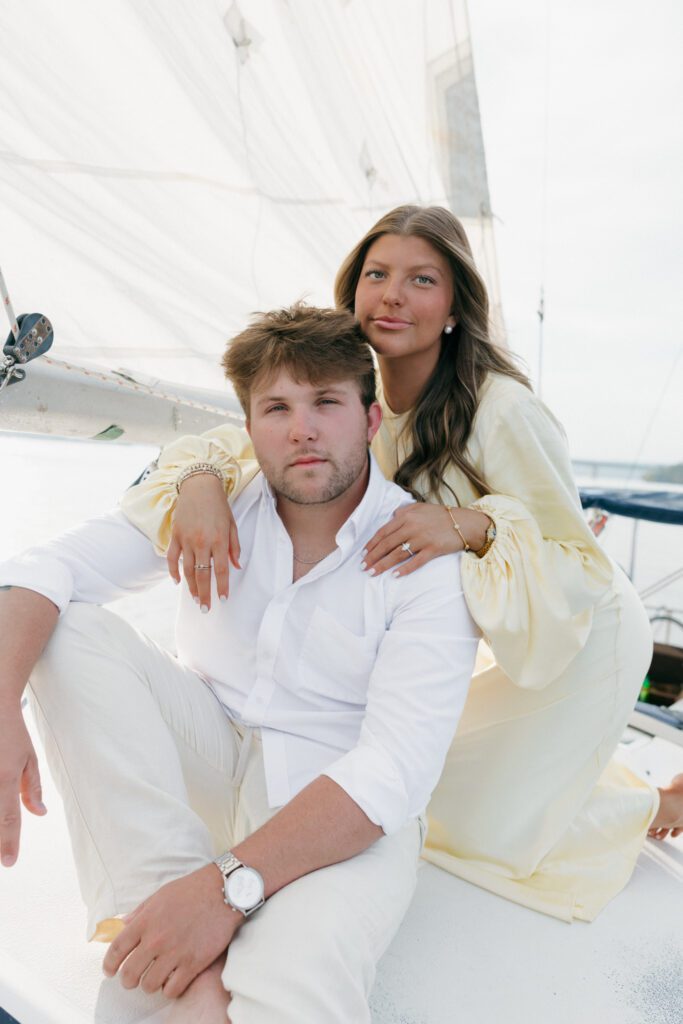 engaged couple on the sailboat "moonlight on the water" at lake Guntersville during engagement session