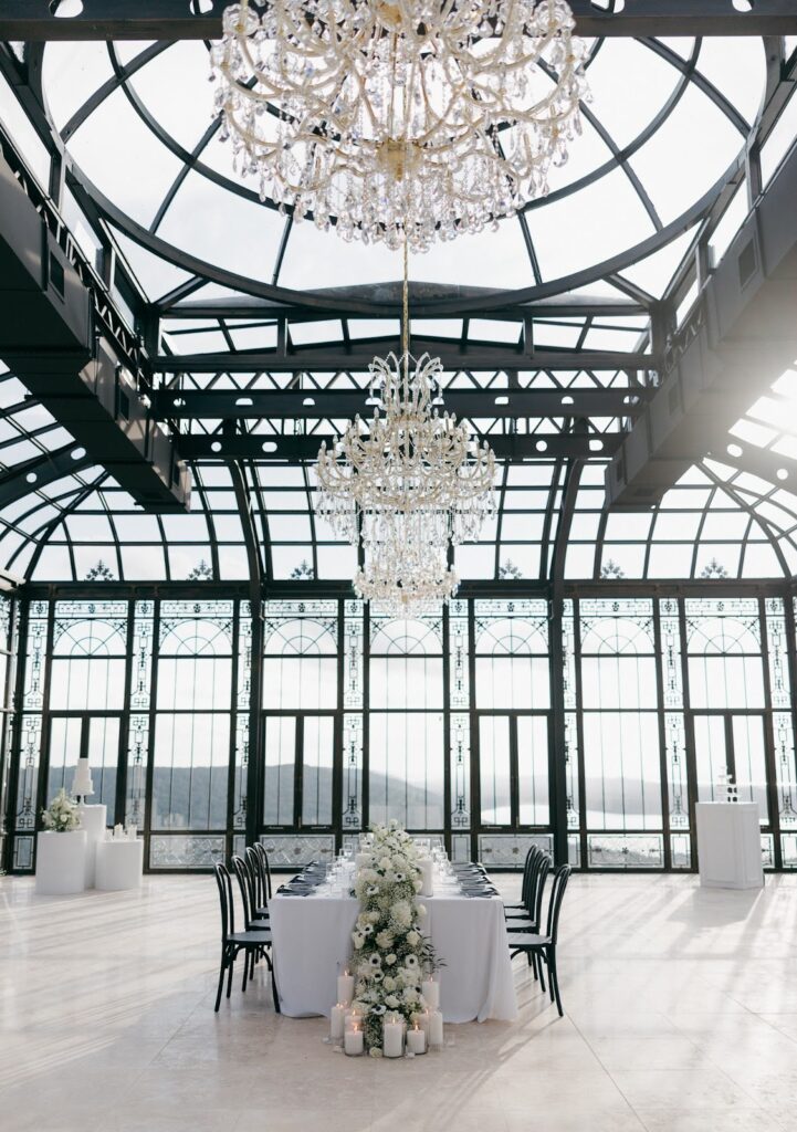 a full view of the black framed glass room at the stone haven wedding venue