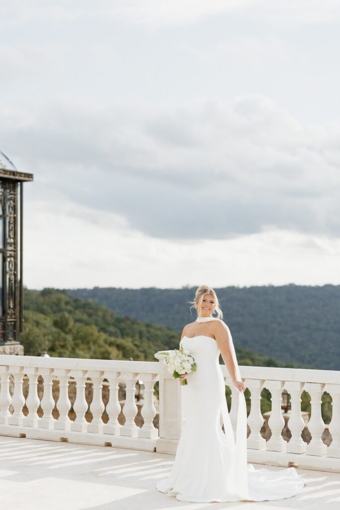 bride standing on the balcony of stone haven wedding venue