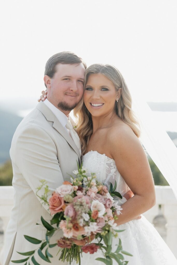 bride and groom smiling at the camera after saying "i do"